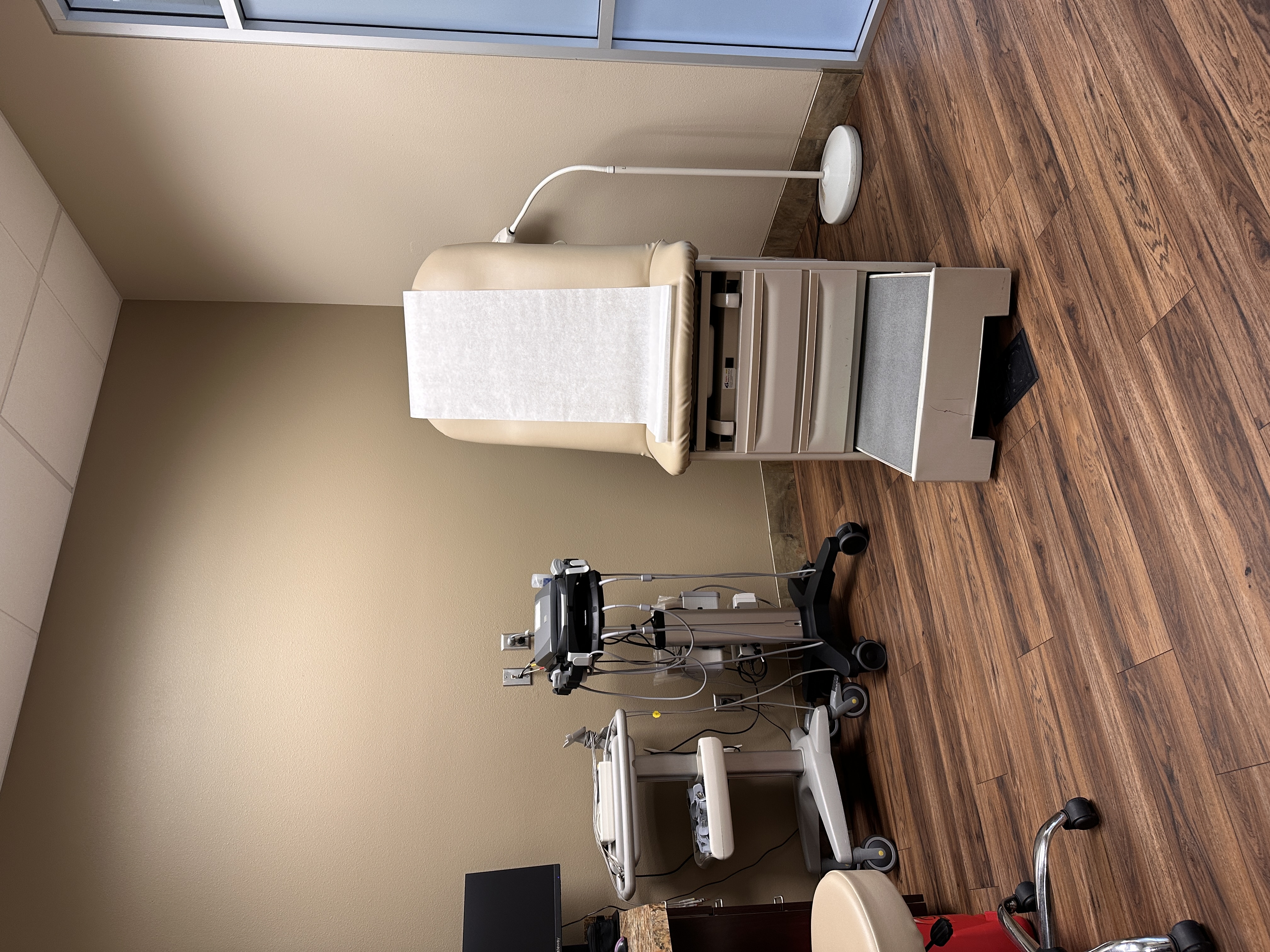 Cardiac evaluation exam room with EKG and ultrasound equipment
